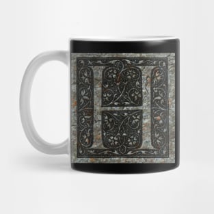 The letter 'H' carved in stone Mug